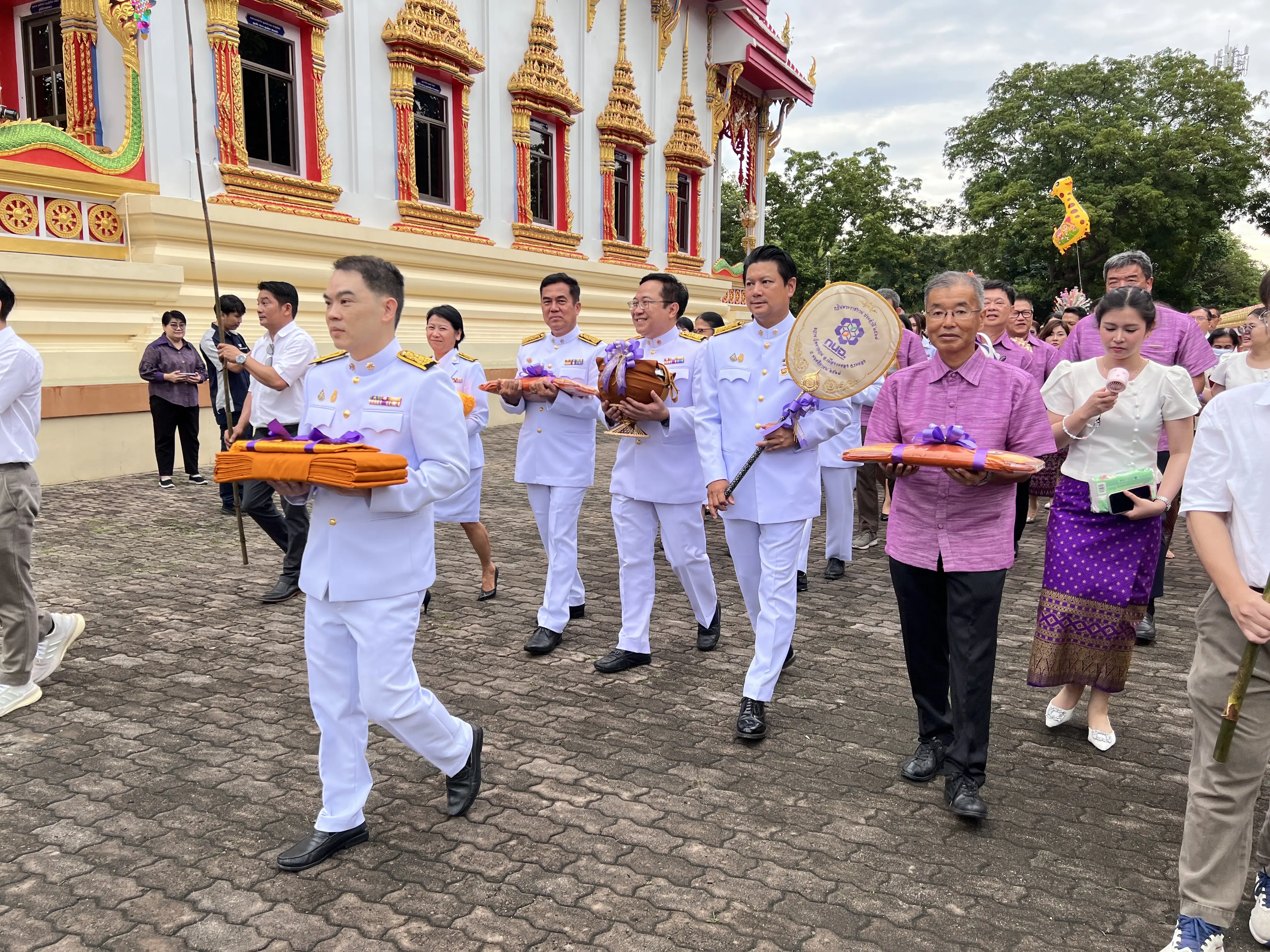"Join in creating great merit Offering Kathin robes at Wat Ta Kuan"
